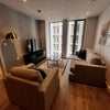 Photo 3: Living room with TV