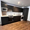 Photo 2: Kitchen with oven, microwave, washer dryer, fridge