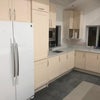 Photo 3: Bright and airy kitchen with plenty of storage cabinets 