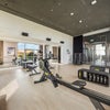 Photo 9: the gym upstairs, there are also free classes for residents