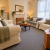 Photo 6: Lounge ground floor with Sony Tv and Sofas