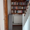Photo 7: Downstairs shelving and linen cupboard