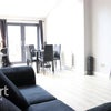 Photo 1: Living room/kitchen