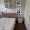 Photo 4: shelving and bedside table