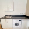 Photo 5: Washing machine and Fridge freezer