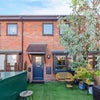 Photo 1: Front of house and garden
