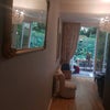 Photo 2: Sitting room opens onto patio