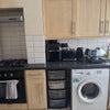 Photo 6: Kitchen with washer and dryer, door to back garden