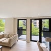 Photo 4: Living room with plenty of natural light and a balcony overlooking the garden