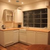 Photo 7: Kitchen sink, cupboards