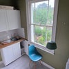 Photo 6: Kitchen has a small foldable table and 2 chairs