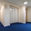 Photo 8: Lift and hallway 
