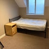 Photo 1: Plenty of storage and small double bed.