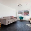 Photo 3: Photo from original listing, now has coffee table and desk (flatmate was working when taking photos)