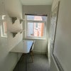 Photo 2: Great desk space and storage with shelves above the desk
