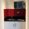 Photo 3: Kitchen area with multi function microwave