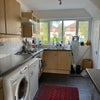 Photo 4: Kitchen and driveway