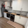 Photo 1: Full kitchen with conduction hob, electric oven, washer/dryer, fridge freezer, microwave, kettle and