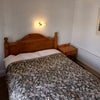 Photo 5: Double bed with built in cupboard. 