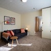 Photo 5: A comfortable and welcoming lounge with dining area and Smart TV