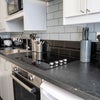 Photo 9: Fully equipped kitchen with quality cookware, utensils and dining essentials