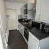 Photo 8: The entrance opens into a well-equipped kitchen with everything needed for day-to-day living