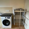 Photo 8: Washing madhine and rail heater in utility room