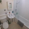 Photo 6: A bathroom with bathroom things