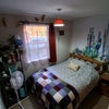 Photo 5: The bedroom - fitted wardrobes and shelves (you just cant see them in this pic)