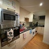 Photo 6: Kitchen with all essential appliances and storage cabinets 