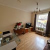 Photo 4: Living area / Large window / Plenty of natural sunlight / TV