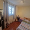 Photo 3: Furnished bedroom includes bed, side, table, built-in, and external wardrobe.