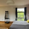 Photo 2: Coat stand view to rear and double bed