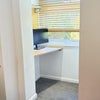 Photo 8: The desk area for your use in the downstairs spare / study room
