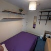 Photo 2: There is are lots of shelves on the walls to save floor space