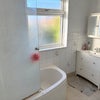 Photo 6: Shower with toilet.