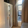 Photo 5: Smaller room. There is also a shelf which is not pictured by the bed
