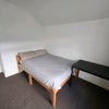 Photo 3: Double bed and dedicated desk/study area