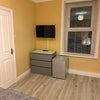 Photo 4: Bedroom 1 Smart Tv and Mini Fridge 