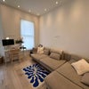 Photo 2: Living area/ kitchen 
