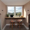 Photo 3: West facing breakfast bar/work station with great rooftop views