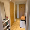Photo 5: Hall, with storage rooms 