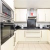 Photo 5: Fully fitted kitchen. Same level