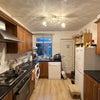 Photo 6: Larger fridge has been provided since this picture