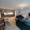 Photo 2: Living area and kitchen