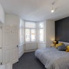 Photo 2: Double bedroom with bay window and feature wall