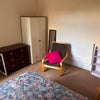 Photo 2: Room has wardrobe, chest of drawers, desk, chair, easy chair, long mirror, bookcase, bedside table