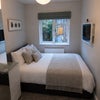Photo 7: Room 3: Wardrobe, chest of drawers, view of garden