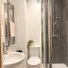 Photo 2: AI enhanced photo Room 1 En-Suite
