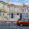 Photo 5: well maintained house with on street parking